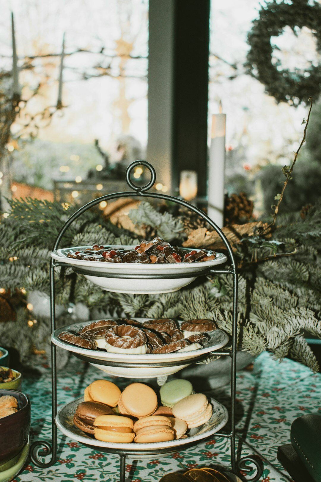 Bowl of hot soup and Christmas baked goods on a winter table