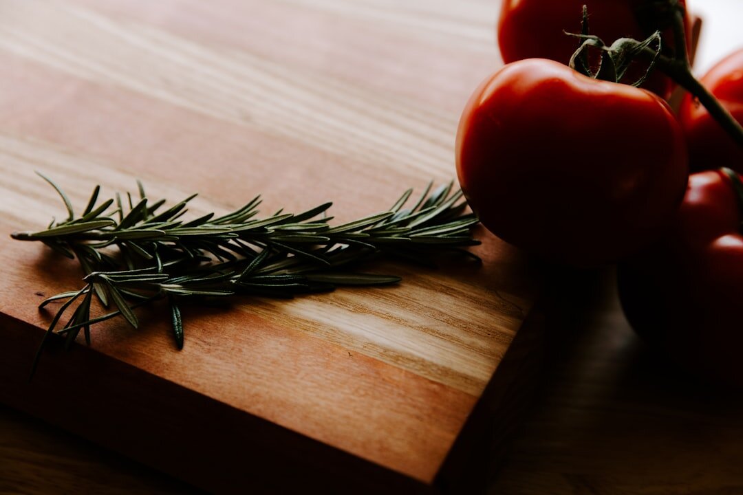Fresh spring vegetables and herbs on a wooden table