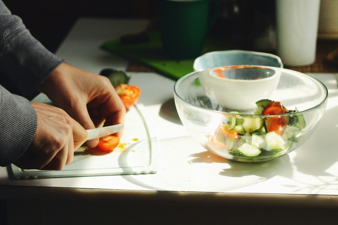 person chopping vegetables