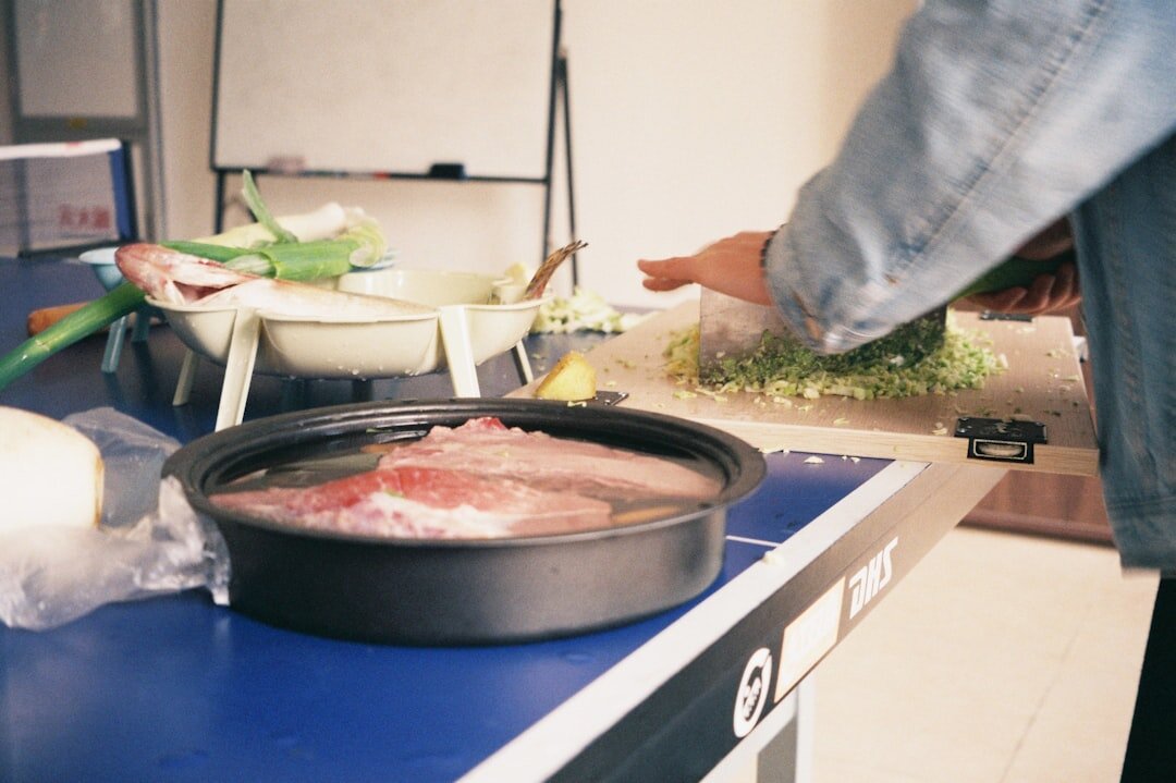 person chopping vegetables