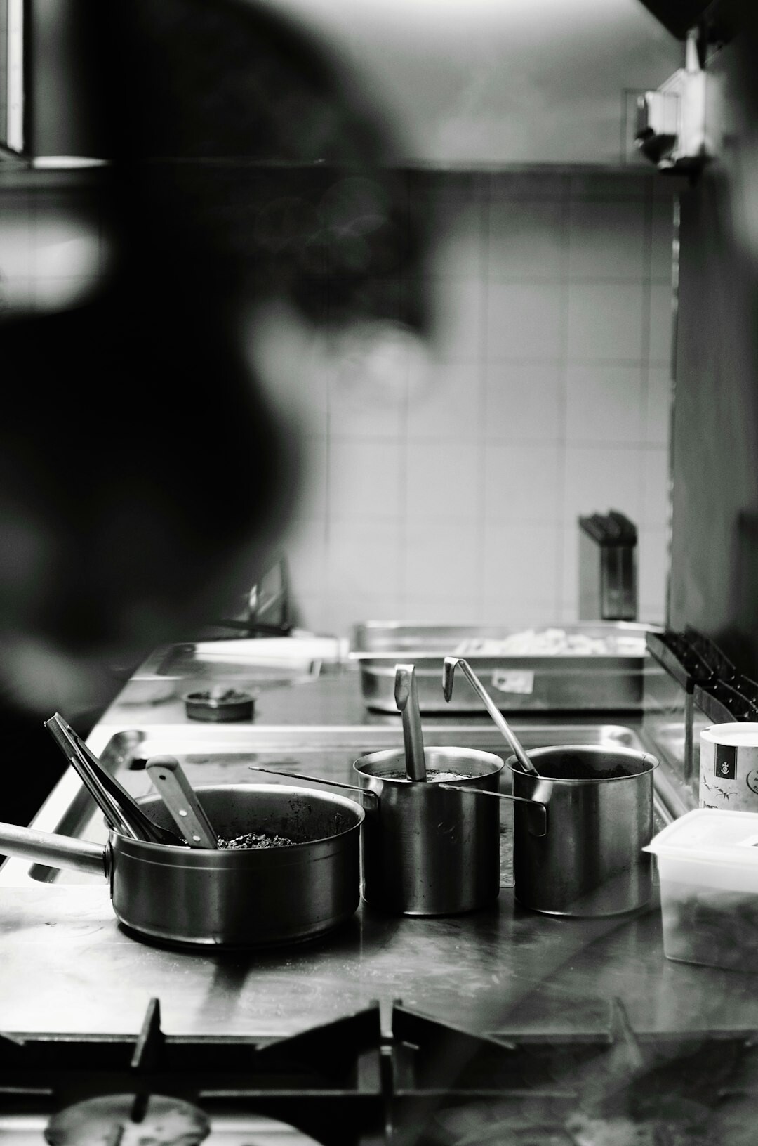 Czech woman in her fifties writing notes in a home kitchen
