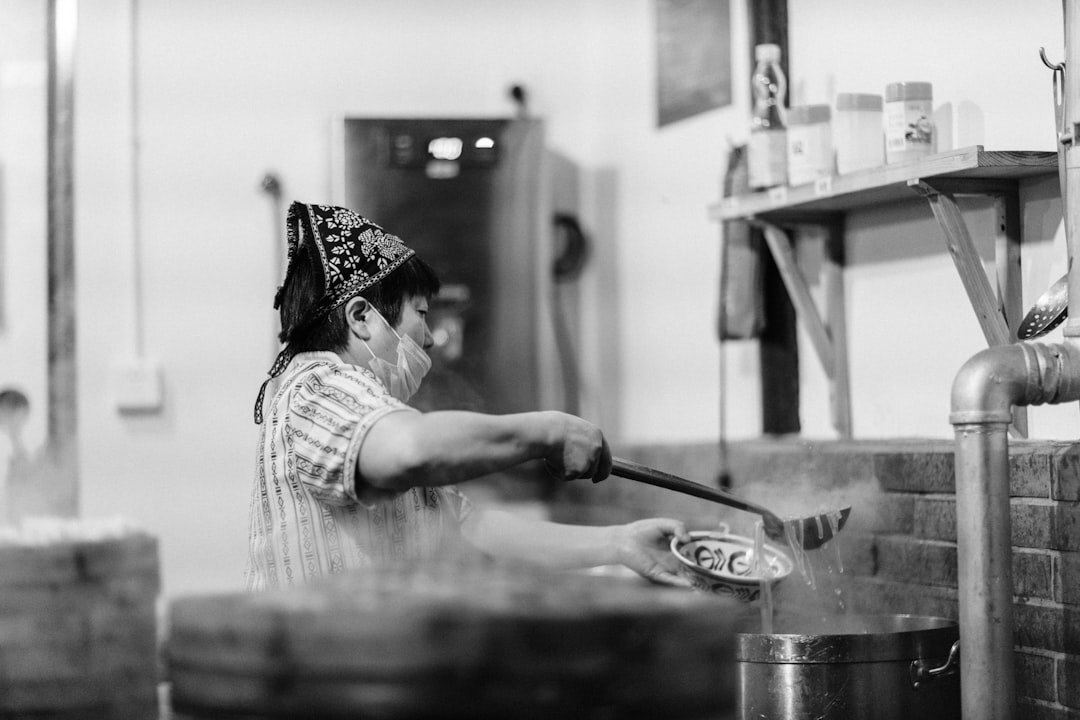 woman stirring jam pot