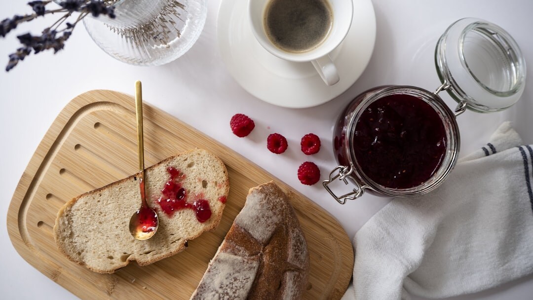 Simple Czech breakfast with bread rolls, butter and jam